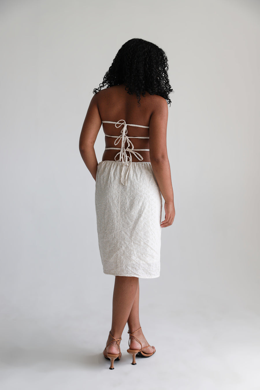 Model showing the back of the dress.