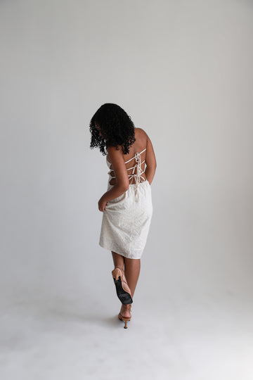 Model posing showing back of the dress.
